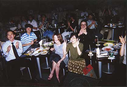 Audience at Tribute to the Love Generation, Tokyo, May 25, 2001; The woman in front and her husband were at all six shows in Tokyo in July, 2000, as well as all three Tokyo shows in 2001. Note the ever present bag of Otis Rush records on the floor next to her.